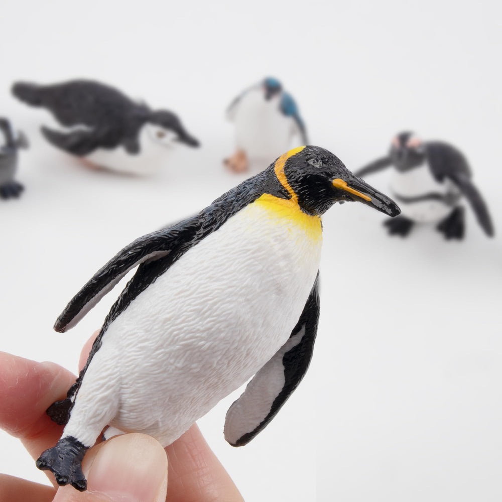 Toymany penguin playset with stable bases for upright display.
