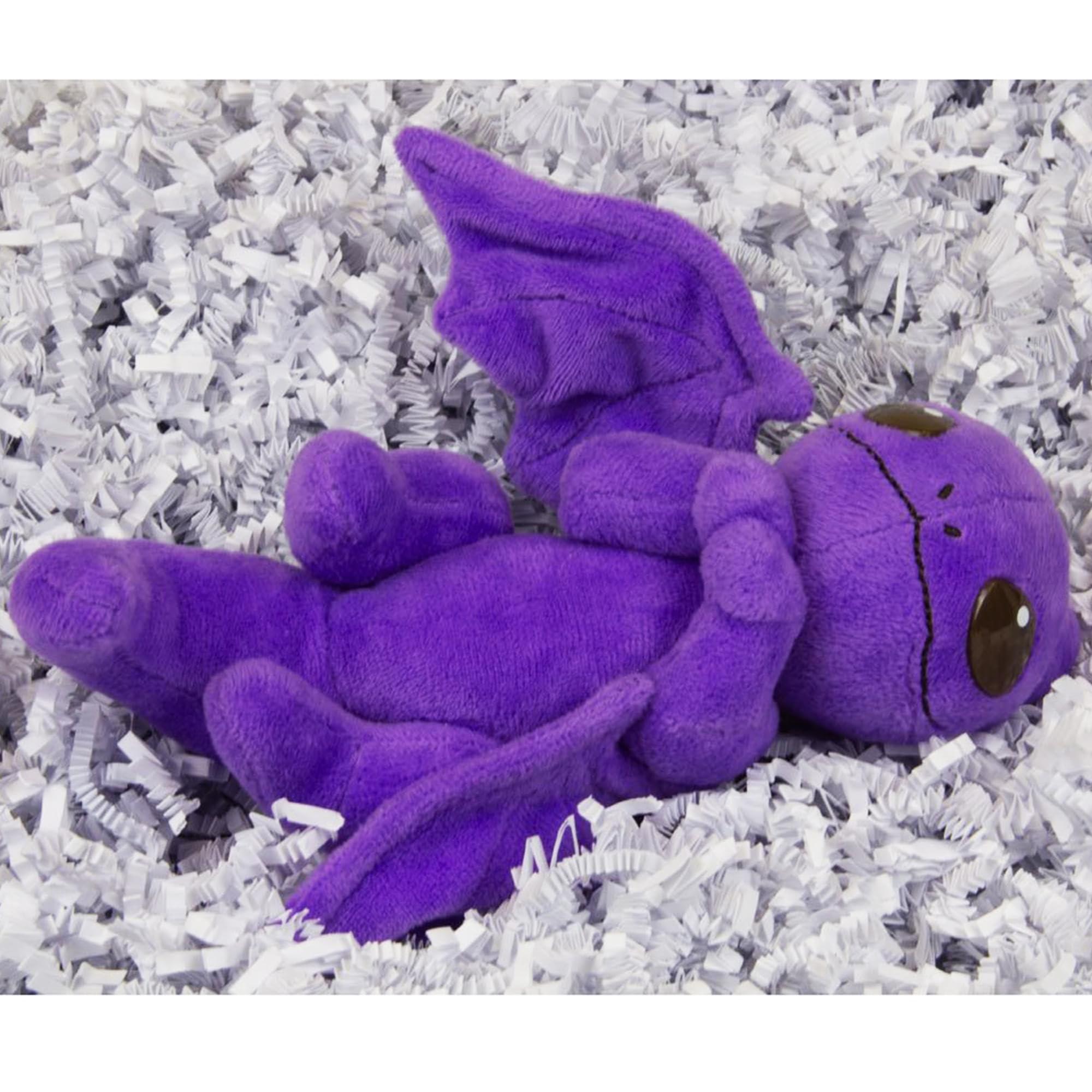 Toynami Miyo's Mystic Musings dragon by a faux fire, cozy scene