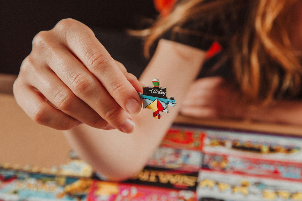 Toynk Arcadeageddon 90s arcade logos across the puzzle surface.