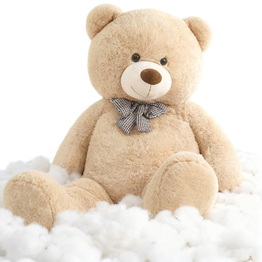 Toys Studio giant teddy bear close-up face with bow, inviting warmth and friendly vibes.