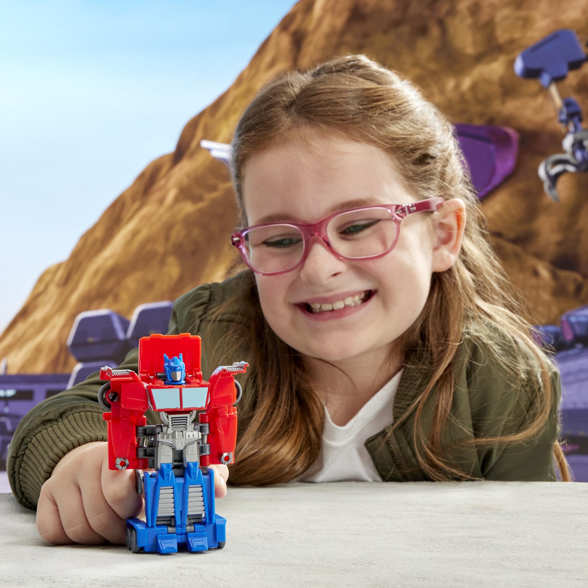 Transformers EarthSpark Optimus Prime pose highlights dynamic action.