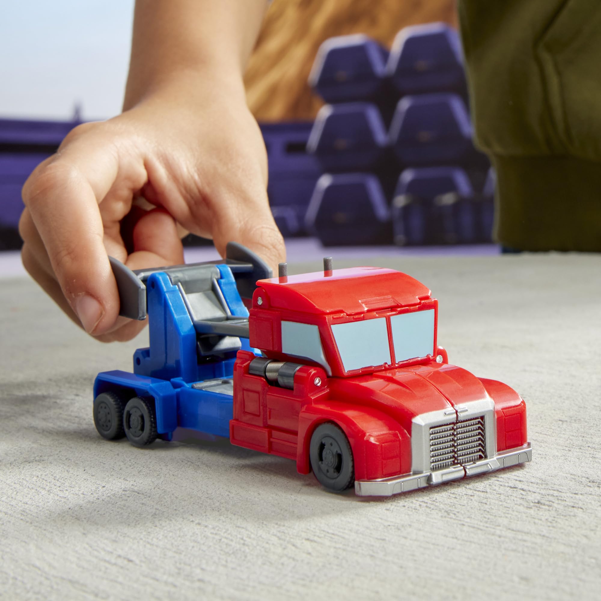 Transformers EarthSpark Optimus Prime smash action on a flat surface.