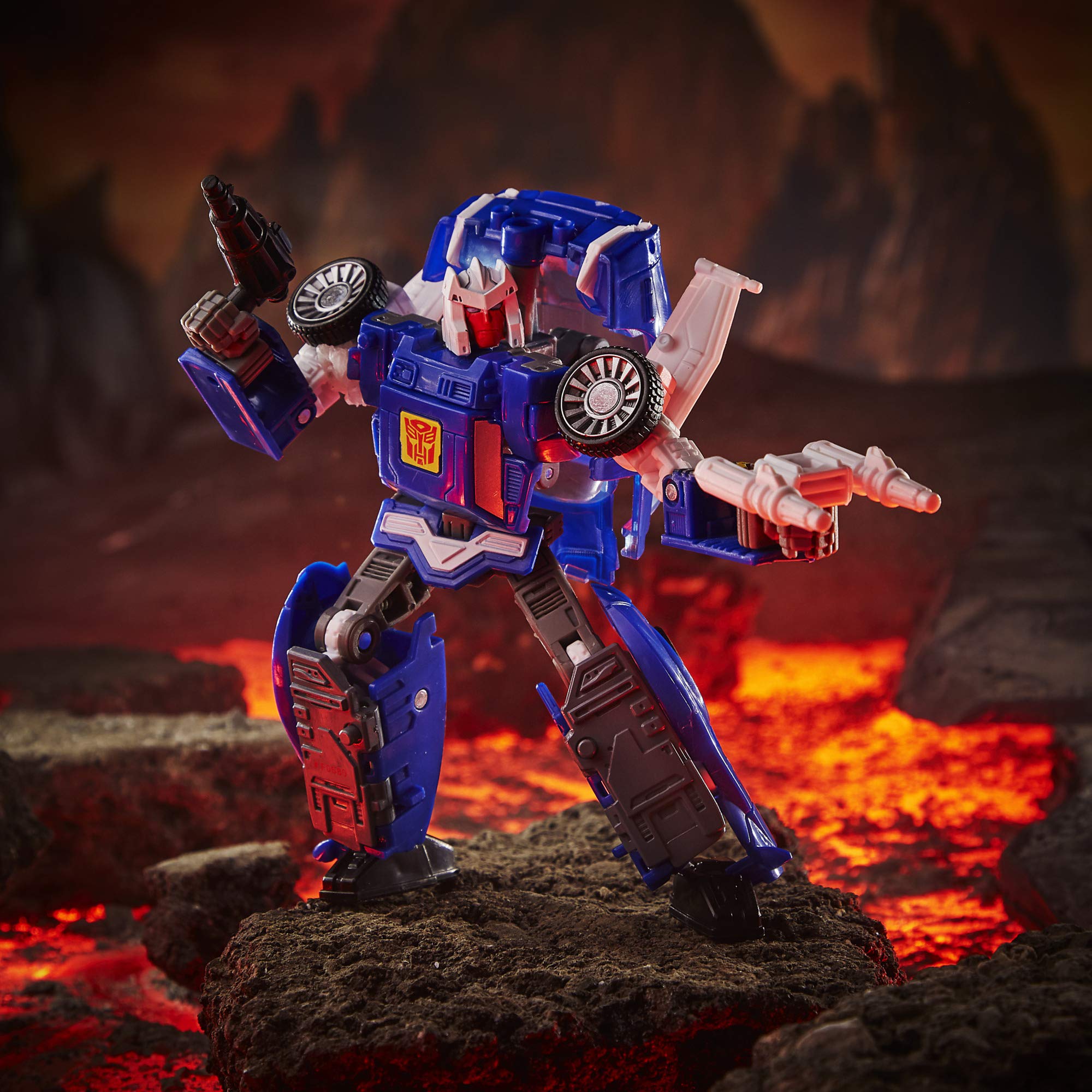 Transformers Kingdom Deluxe WFC-K26 Autobot Tracks sportscar mode highlights sleek blue design for display.