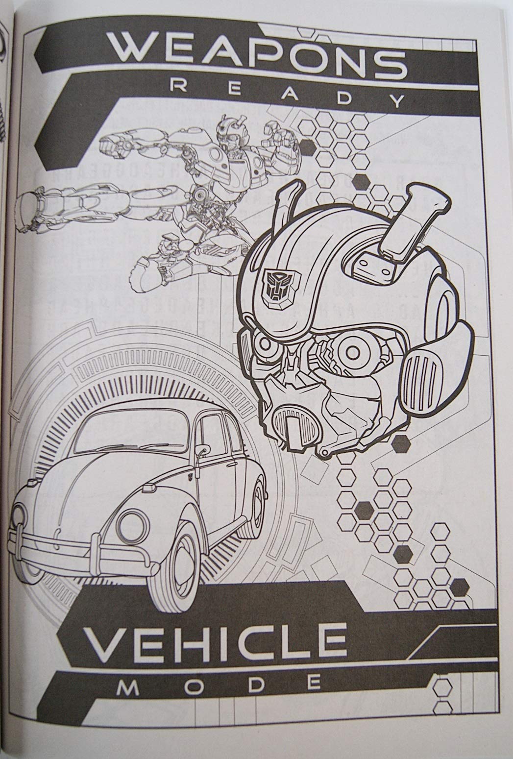 Open spread of Transformrs Bumblebee pages inviting creativity during indoor coloring sessions.