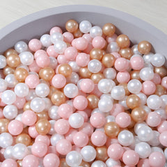 Colorful mix of pink, pearl brown, and pearl white balls for vibrant ball pits.