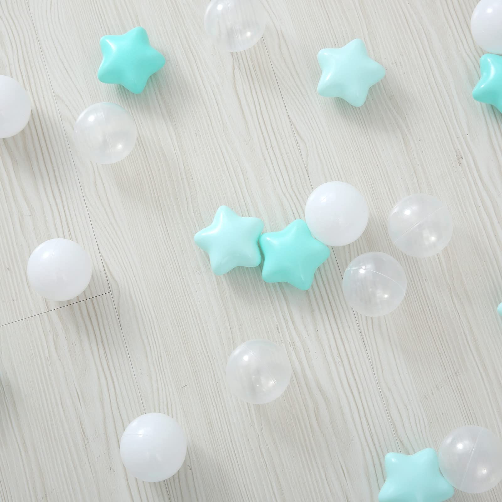 A toddler playing with TRENDPLAY star ball pit balls in a safe environment