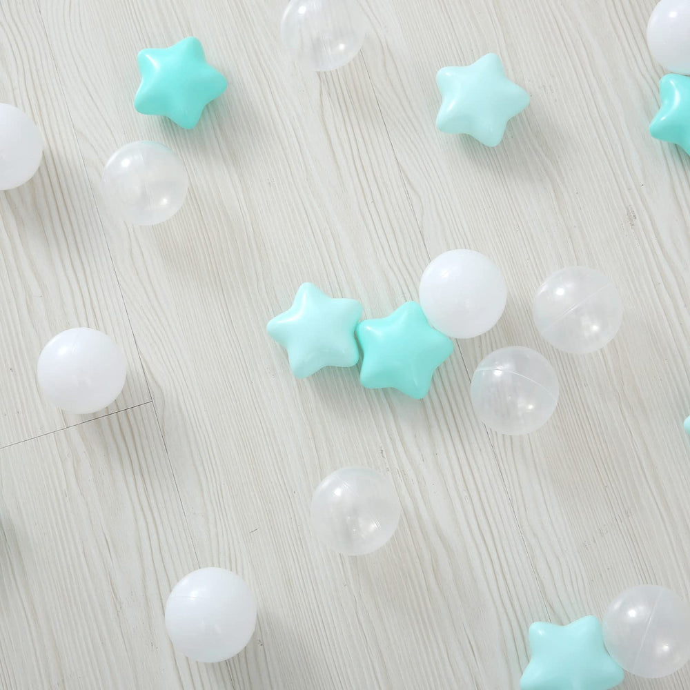 A toddler playing with TRENDPLAY star ball pit balls in a safe environment