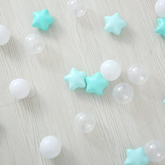 A toddler playing with TRENDPLAY star ball pit balls in a safe environment