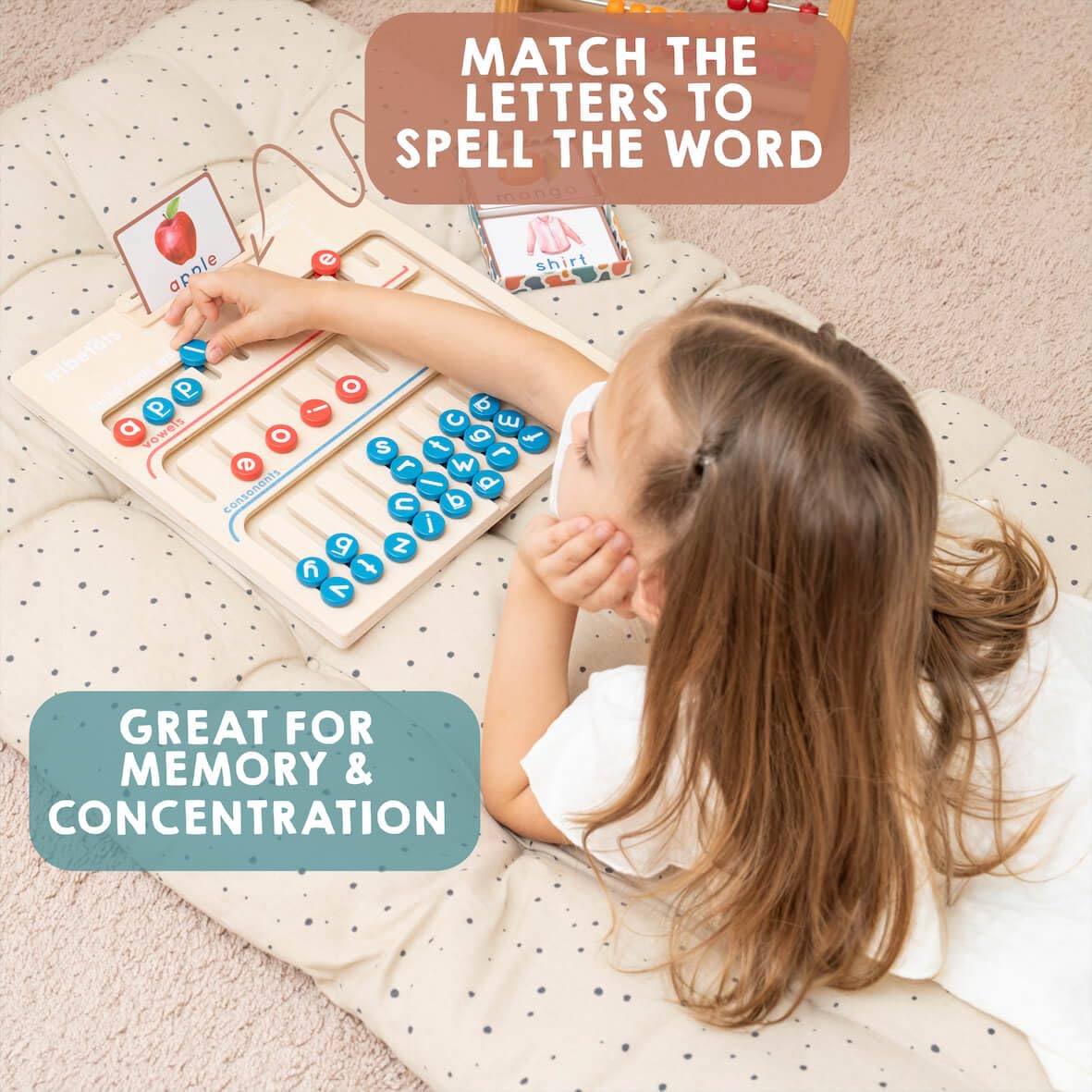 Child using Tribetots board for hands-on letter matching.