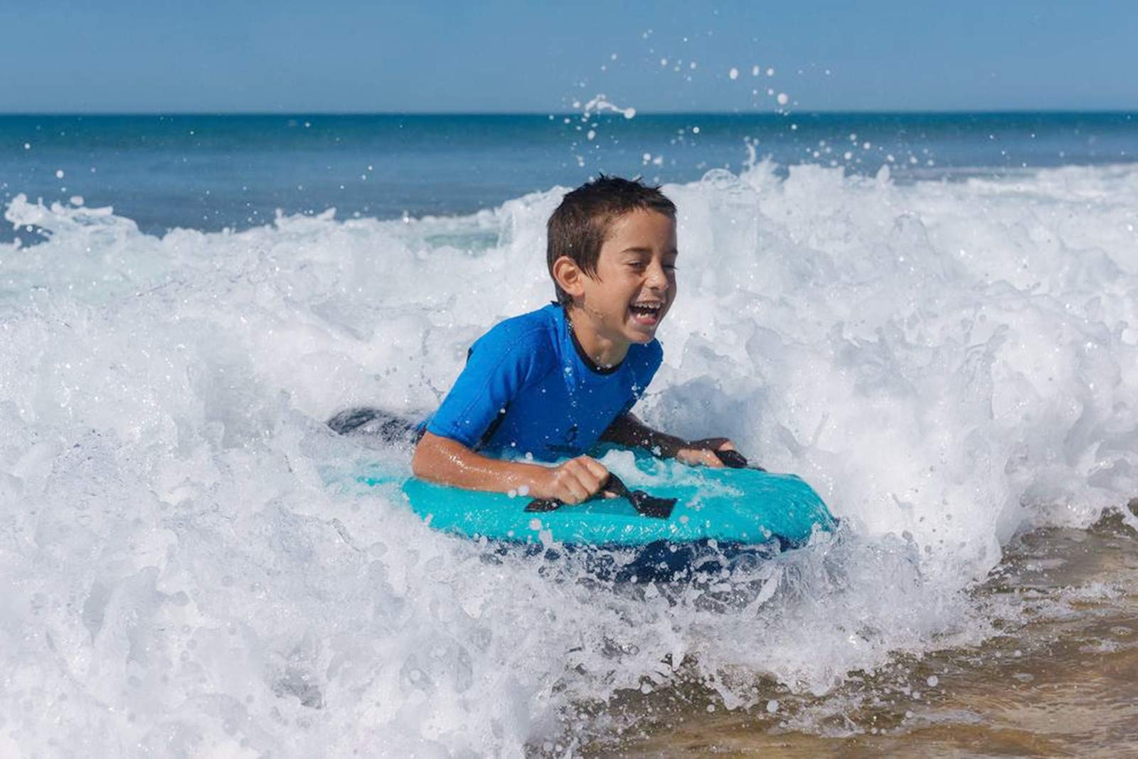 Trivamo beach setup showing family fun with inflatable board.