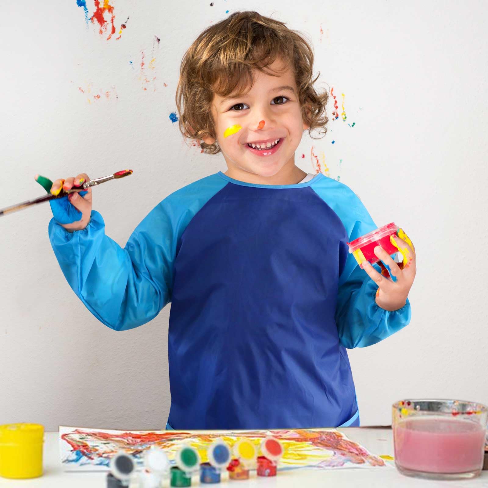 Front pockets hold brushes and crayons for quick art sessions.