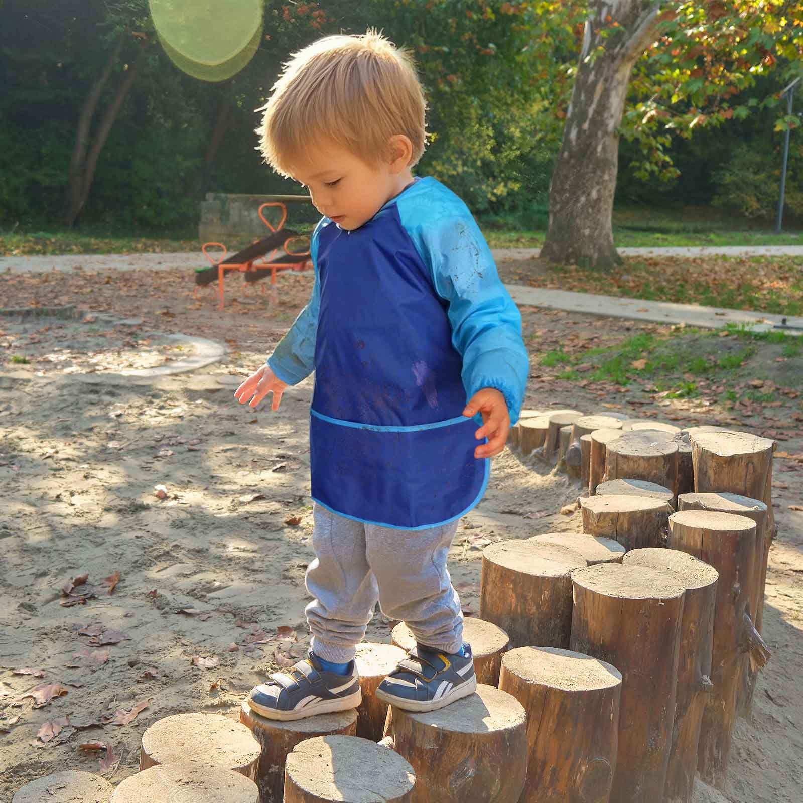 Lightweight waterproof polyester keeps clothing dry during messy activities.