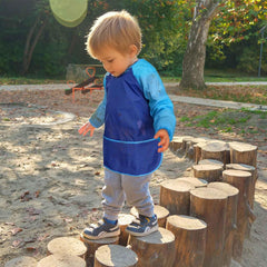 Lightweight waterproof polyester keeps clothing dry during messy activities.