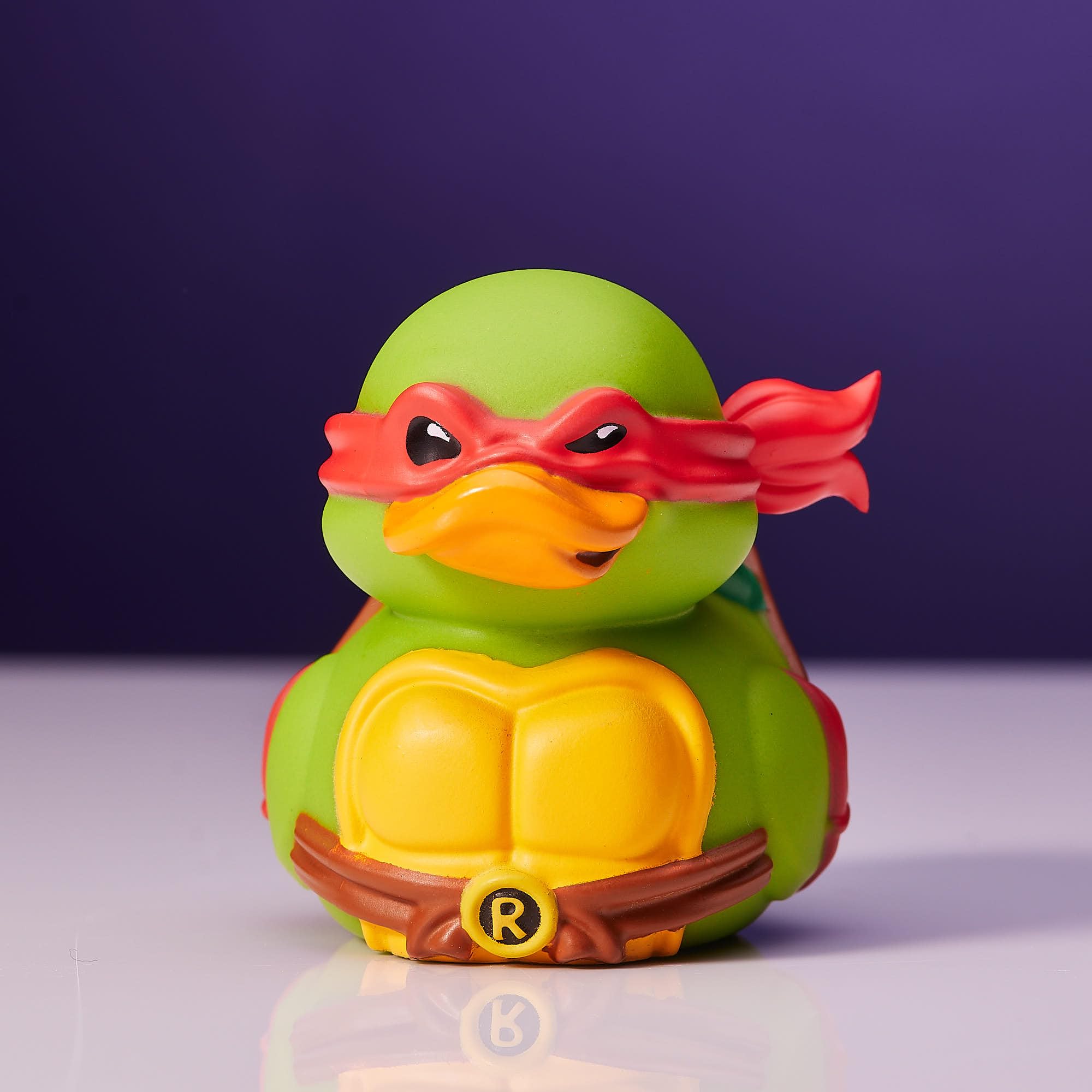 TUBBZ Mini Raphael out of tub on a display shelf for desk use.