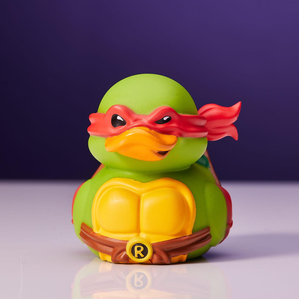 TUBBZ Mini Raphael out of tub on a display shelf for desk use.