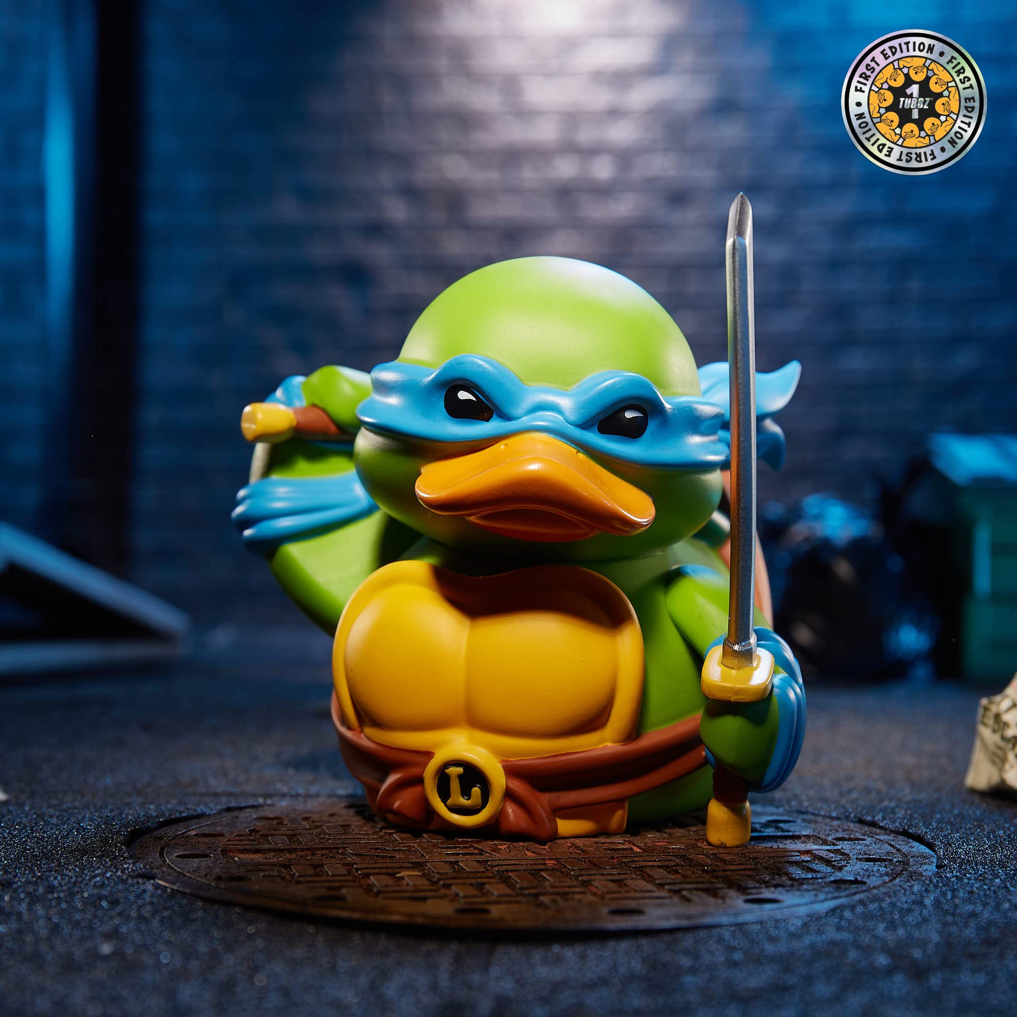 TUBBZ TMNT Leonardo logo display stand perfect for shelf collections.