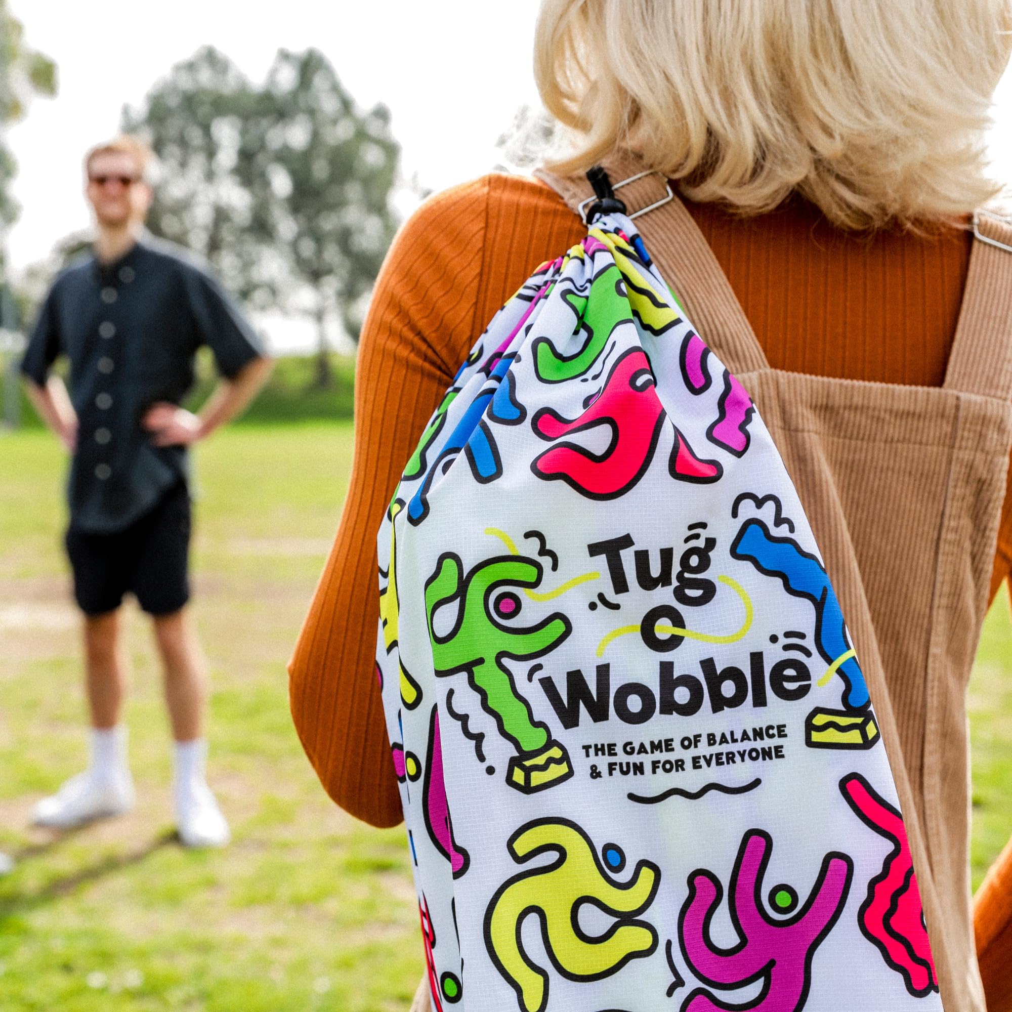 TUG O' WOBBLE backyard-game setup invites families to play.