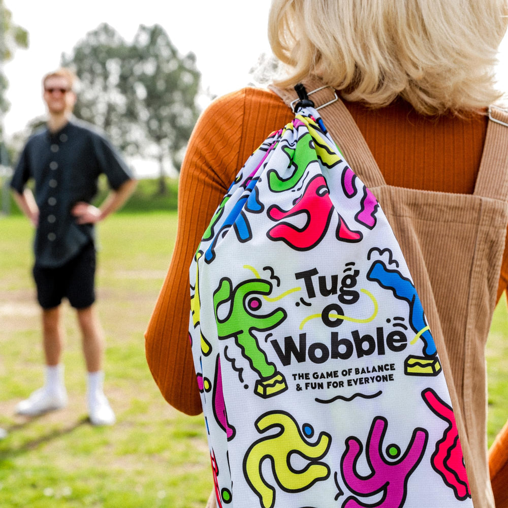 TUG O' WOBBLE backyard-game setup invites families to play.