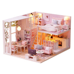 TuKIIE DIY miniature dollhouse kit in assembly stage showing precise wooden parts