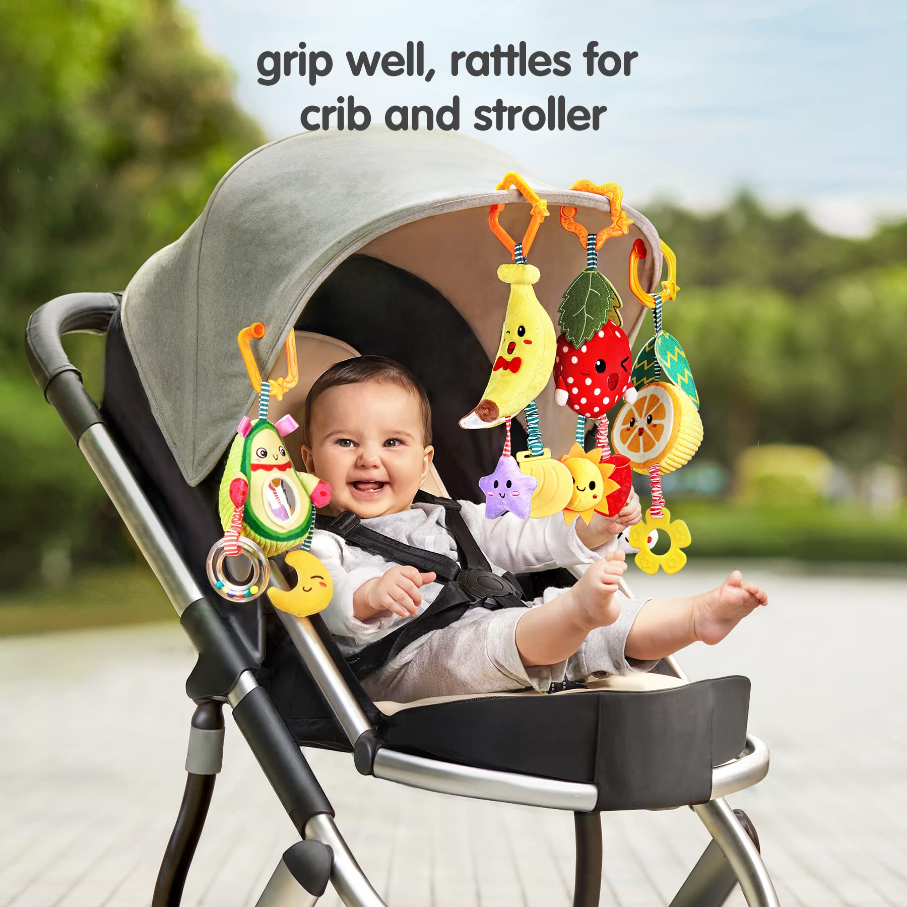 TUMAMA KIDS orange fruit rattle hanging with soft teethers for teething moments and tactile exploration.