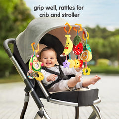 TUMAMA KIDS orange fruit rattle hanging with soft teethers for teething moments and tactile exploration.