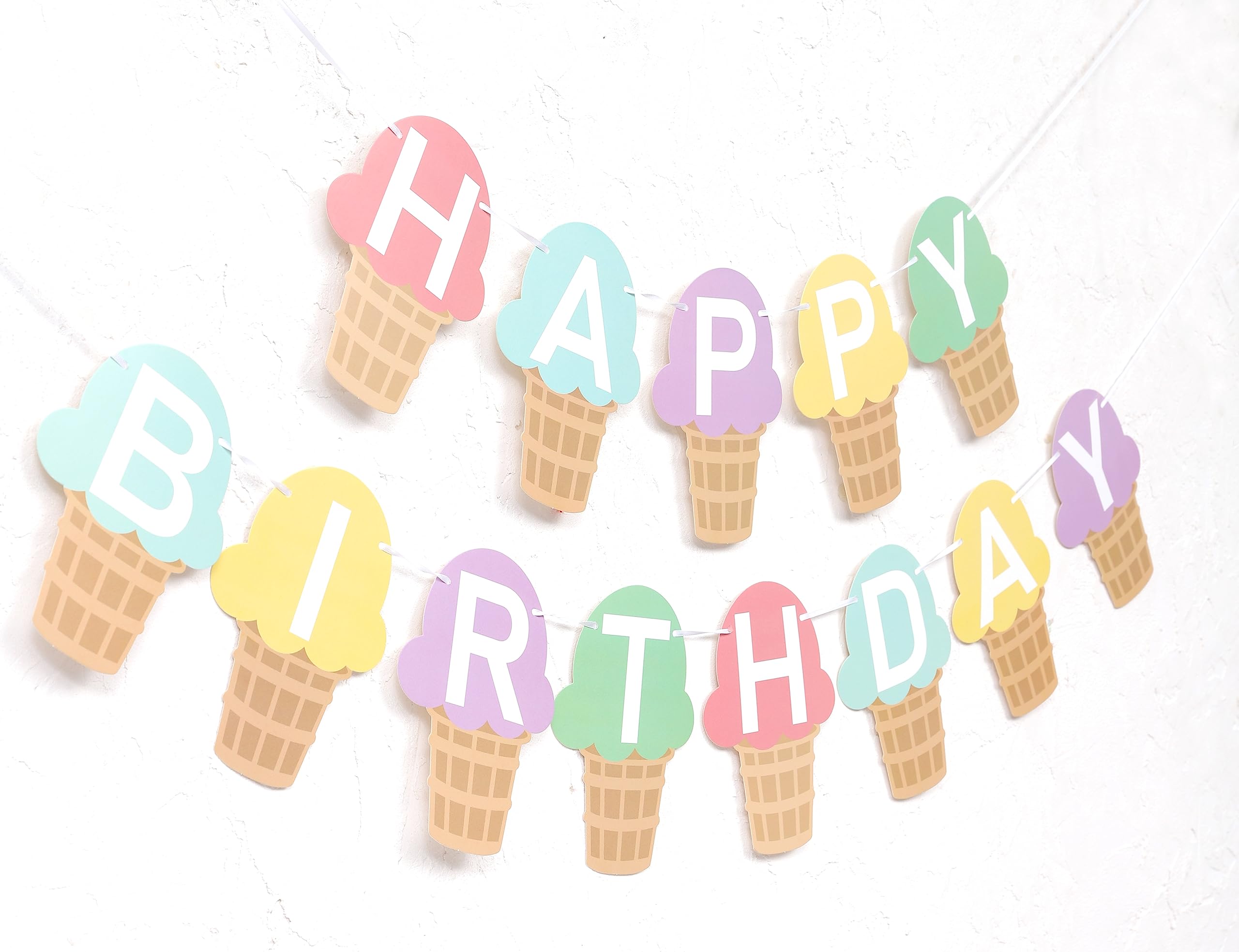 TUTOTU ice cream banner cone close-up highlights playful treats.