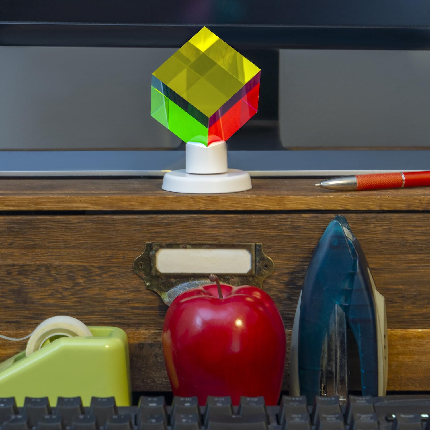 Twiddler Toys 2-inch color prism as compact art and focus aid on a desk
