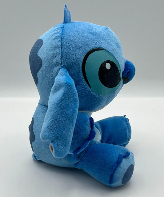 TY Stitch blue plush toy face close-up showing friendly character details.