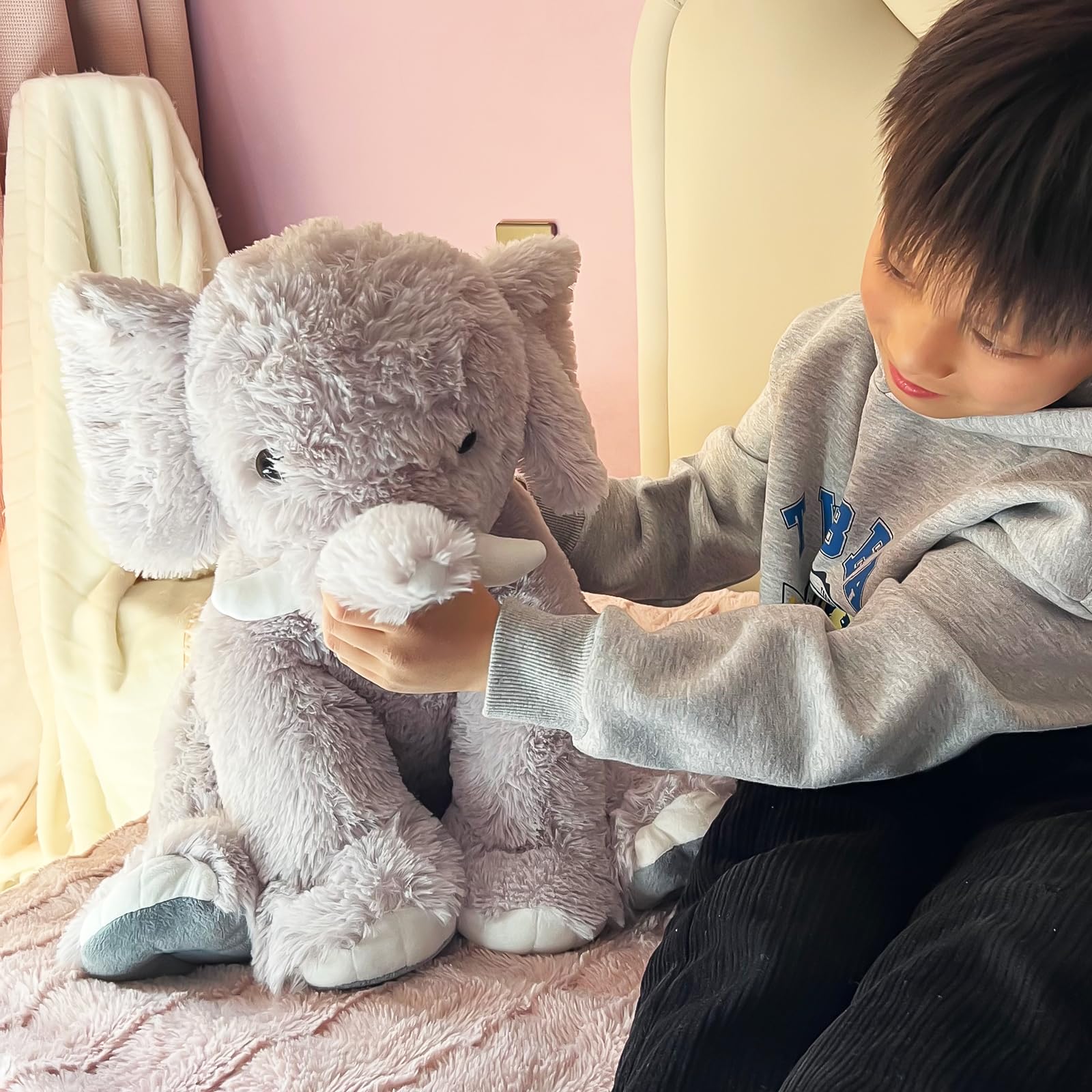 UBABER elephant plush in a cozy room decor setup adding warmth to any space.