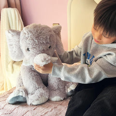UBABER elephant plush in a cozy room decor setup adding warmth to any space.