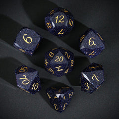 UDIXI blue sandstone gemstone dice closeup showing sparkling facets.