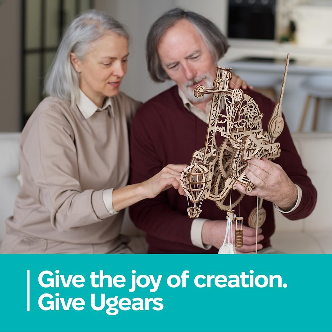 UGEARS Aero Clock gear movement drives hour and minute discs with gravity action.