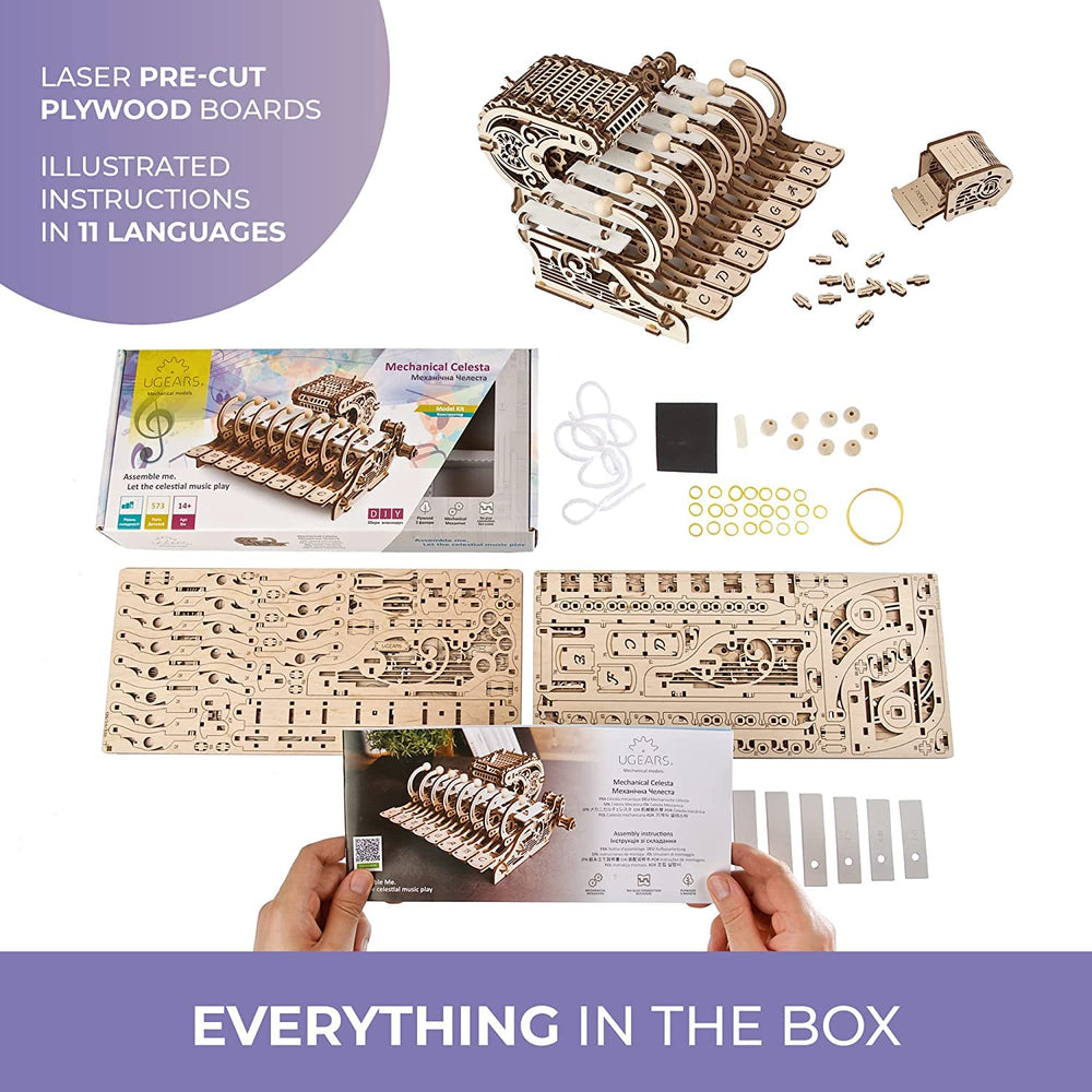 UGEARS Celesta laser-cut pieces spread on a worktable; 573 pieces for immersive building