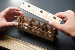 UGEARS Hogwarts Express figurines mounted on moving supports for dynamic action