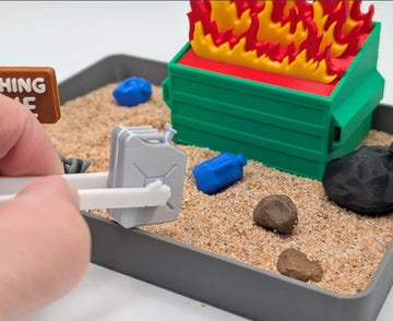 UglaForge Dumpster Fire Zen Garden closeup features tactile elements for relaxing sensory play.