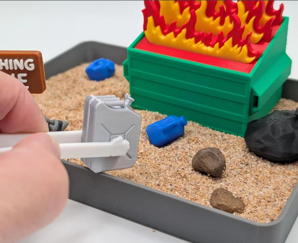 UglaForge Dumpster Fire Zen Garden closeup features tactile elements for relaxing sensory play.