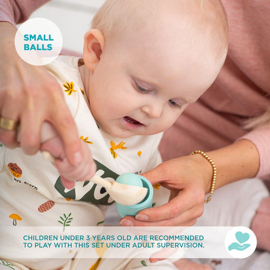 Ulanik Montessori-inspired toddler color sorting cups with wooden balls.