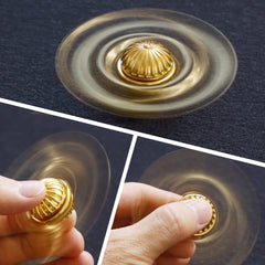 Umnodobn Gold Sphere Spinner on desk shows quiet, focused use