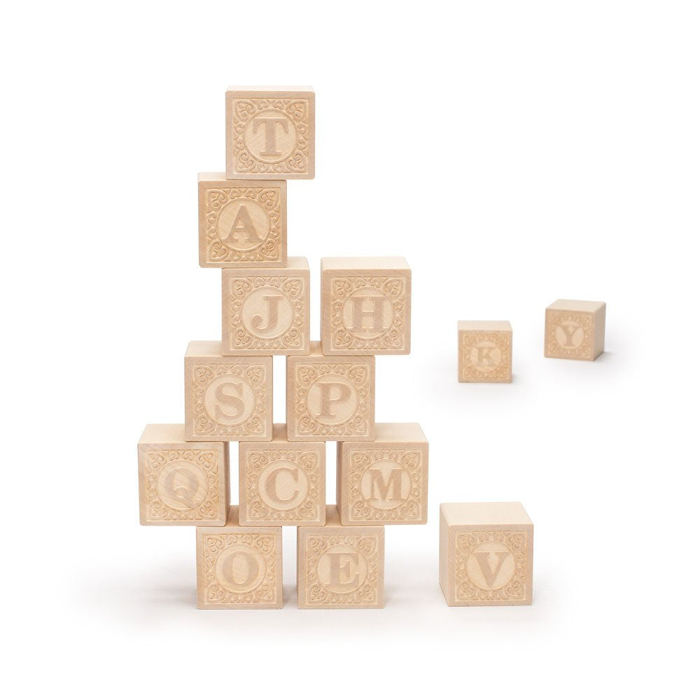 Uncle Goose uppercase Alphablank blocks with bare basswood cubes for open-ended play.