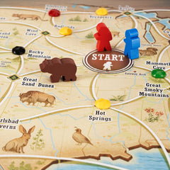 Underdog Games Trekking the National Parks board artwork enhances immersion during outdoor-themed sessions.
