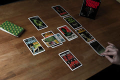 Todd Alcott horror tarot deck spread showing layout and colors.