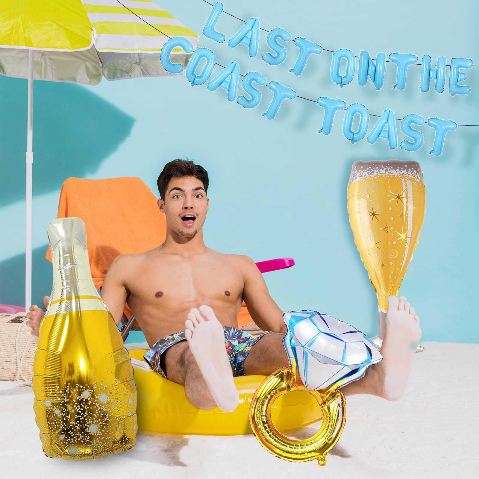 Uniticber champagne bottle balloon complements the seaside celebration aesthetic.