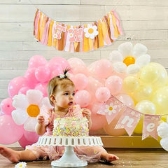 UOAOU Groovy Two banner serves as a photo prop during cake moments.