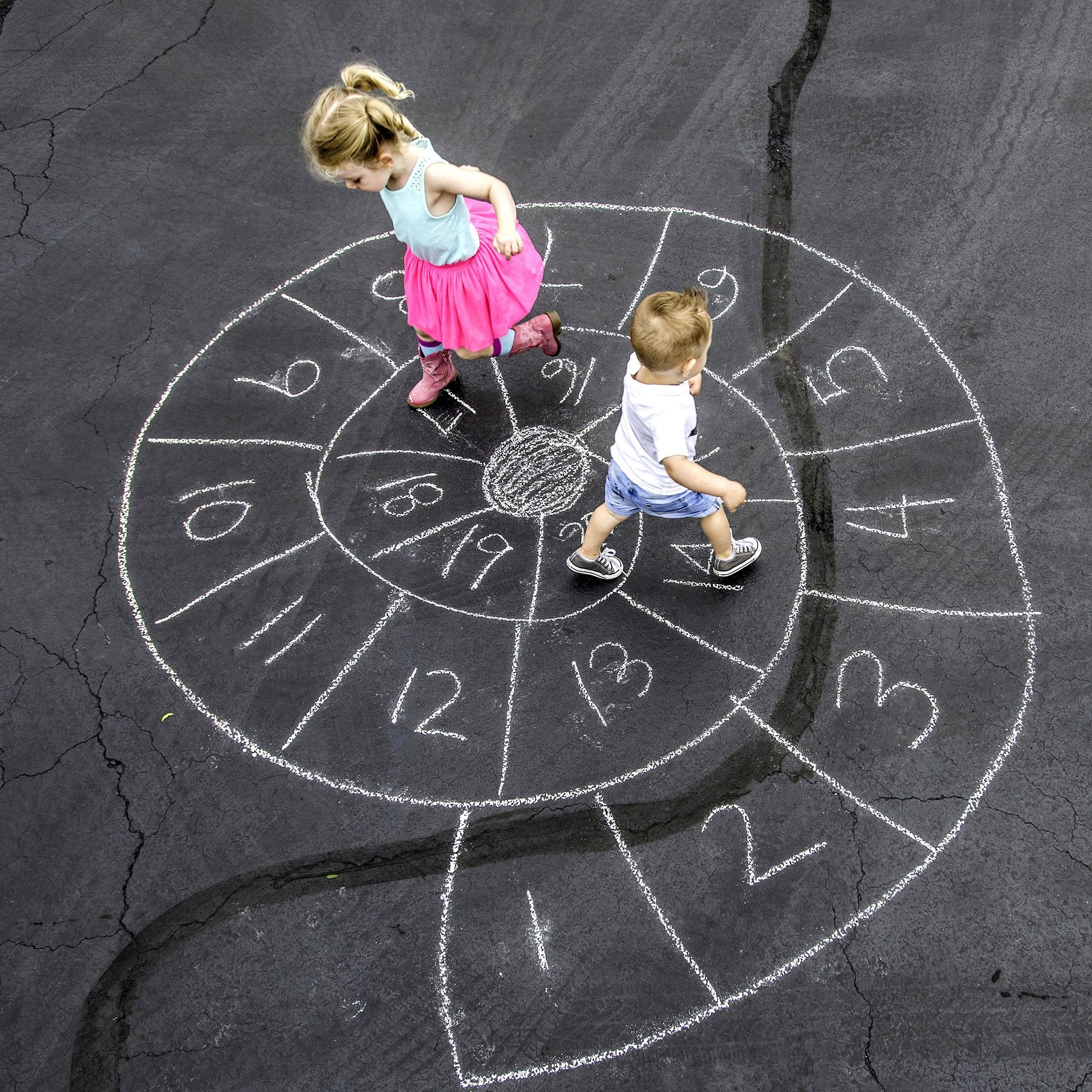 Urban Infant chalk art on city sidewalks sparks imagination for kids.