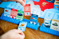 USAOPOLY 10 Days in the USA car connections illustrate driving routes