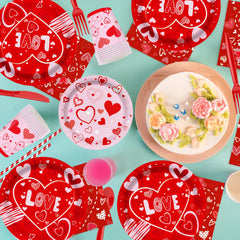 Valentine's Day party supplies tablecloth with red hearts frames the table beautifully.