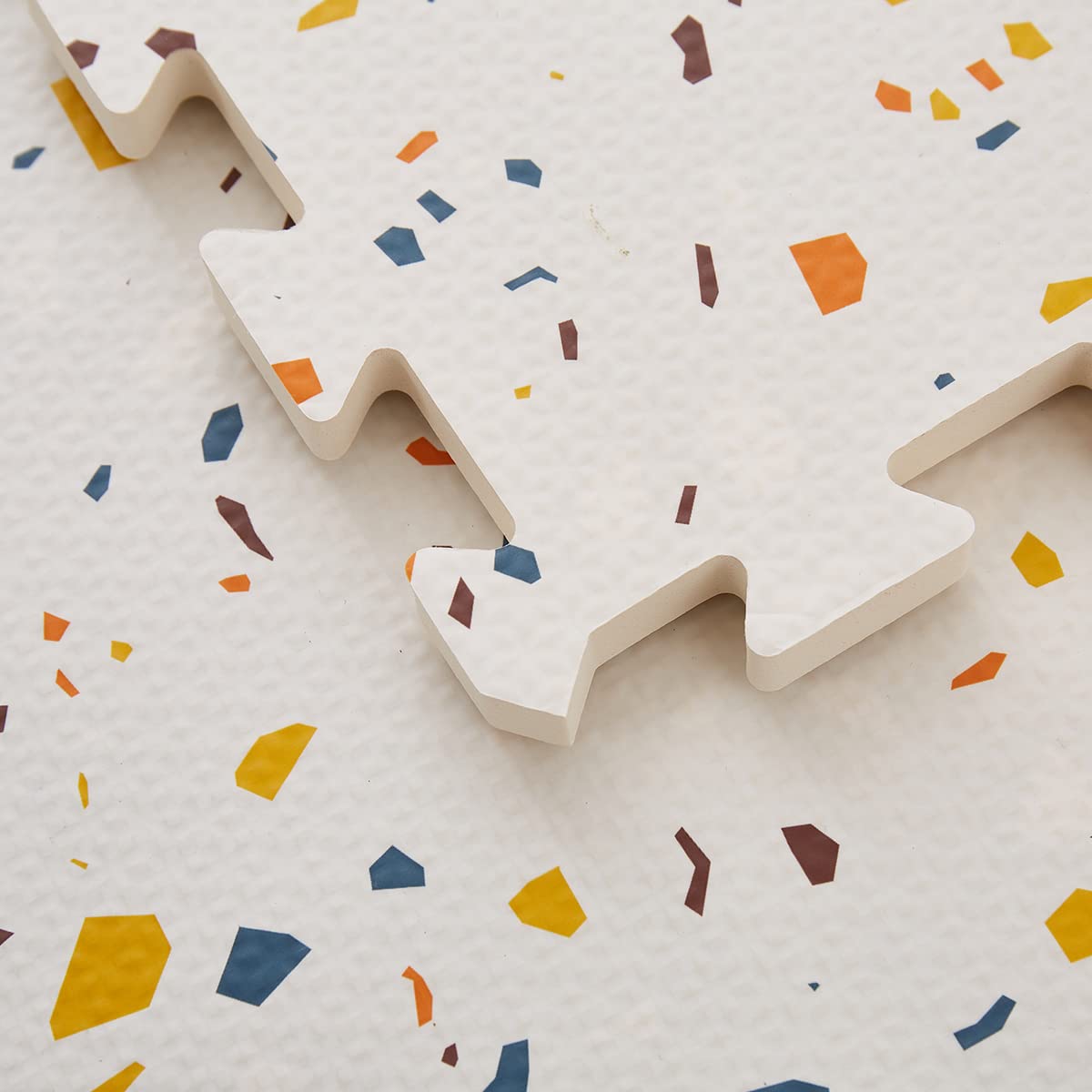Valioza Terrazzo Playmat with interlocking tiles for quick setup and safe play space.