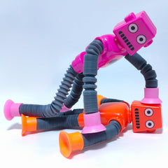 Veakeqe robot toy with suction-bottom sticks to smooth surfaces for creative posing.