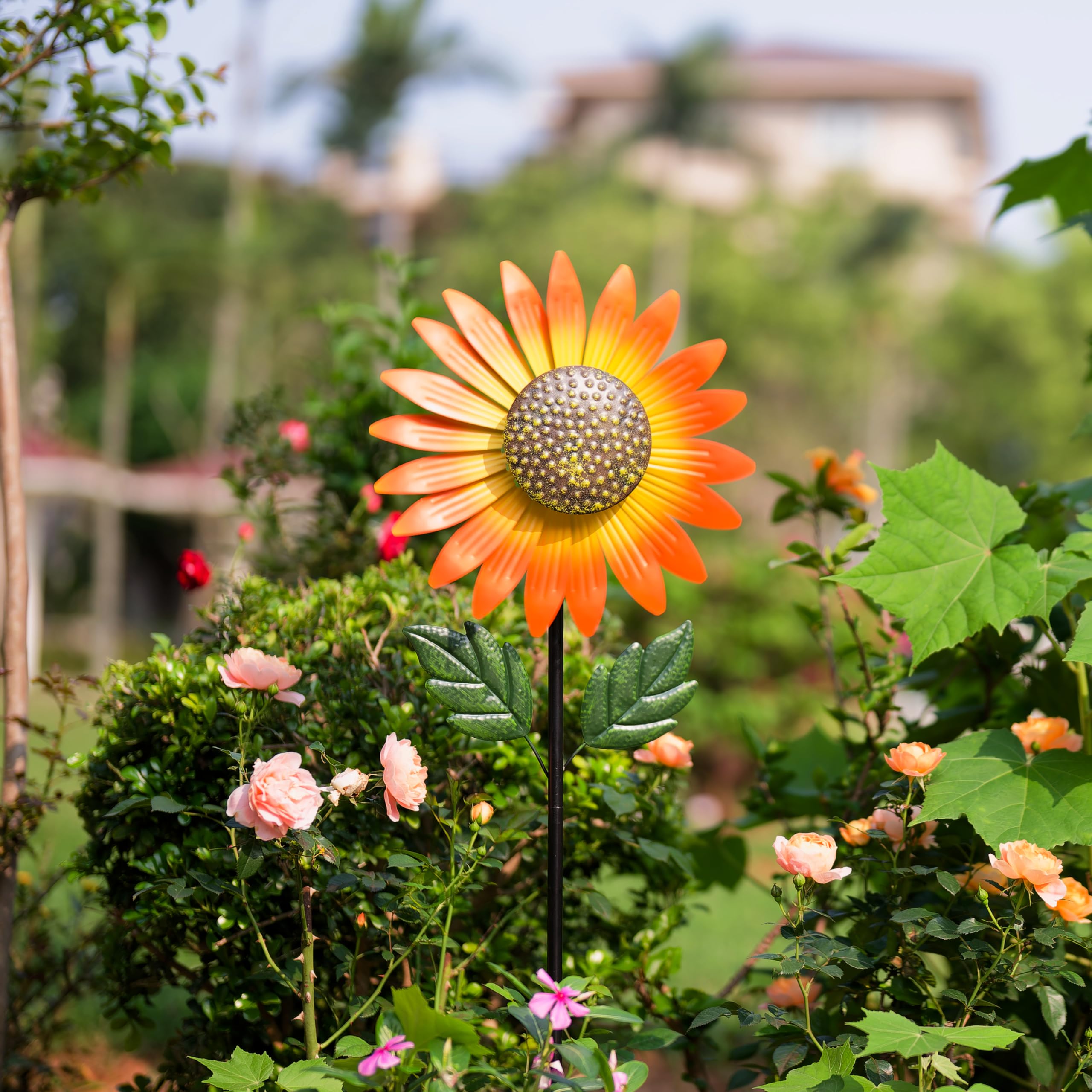Venniy wind spinner creates charming garden ambience for relaxing evenings.