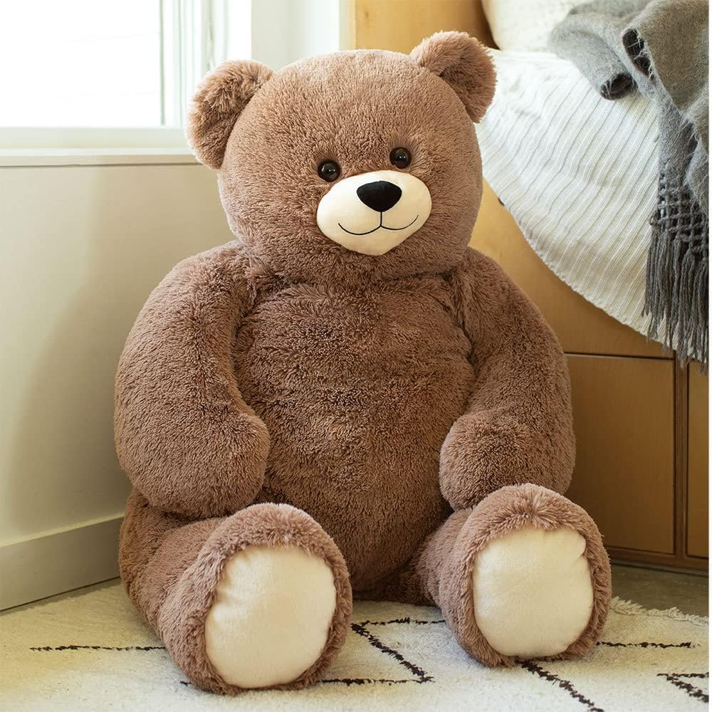 Vermont Teddy Bear cozy companion for bedroom or living space relaxation.